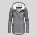 Waterproof hooded jacket with long silhouette for women | Madelyn